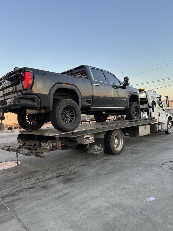 Lifted GMC Denali pickup on the flatbed