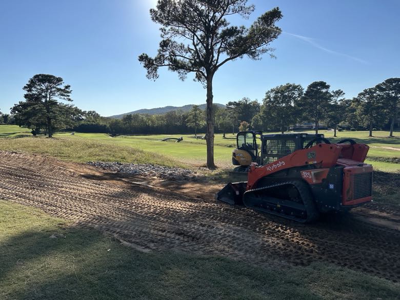 Kubota skid steer being recovered off-road