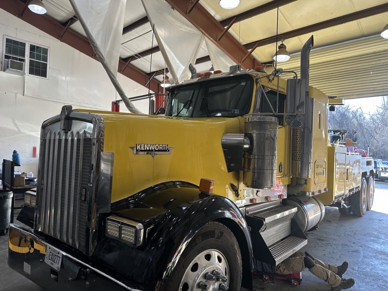 Heavy-duty Kenworth tow truck in the service shop